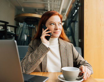 Young woman using mobile phone