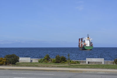 Scenic view of sea against blue sky