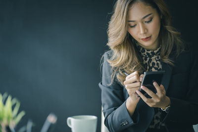 Young woman using mobile phone