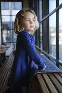 Side view of cute girl looking away