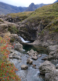 Scenic view of river flowing through rocks