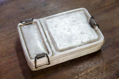 High angle view of old camera on table