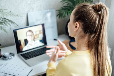 Young woman business woman student teacher tutor having online virtual video call. freelancer