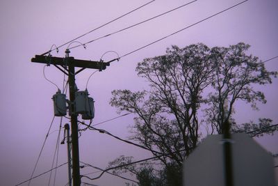 Low angle view of silhouette tree against sky