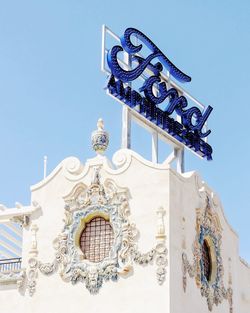 Low angle view of built structure against blue sky