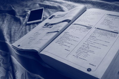 High angle view of open book on table