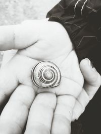 Cropped image of hand holding ring