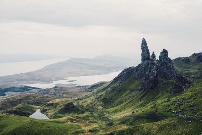 Scenic view of old man of storr against sky