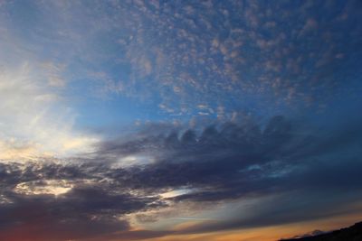 Low angle view of clouds in sky during sunset