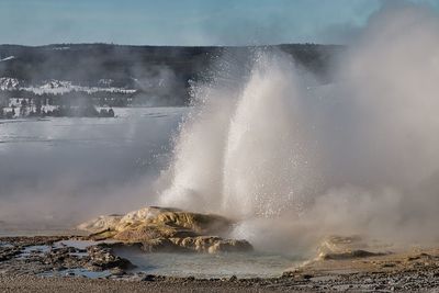 Waves splashing on rocks at shore