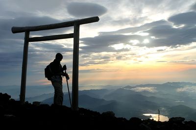 Silhouette man on mount fuji at sunrise