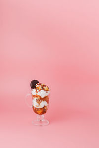 Close-up of ice cream against pink background