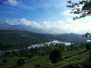 Scenic view of lake against cloudy sky