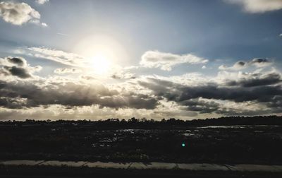 Scenic view of field against sky at sunset