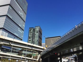 Low angle view of skyscrapers against clear sky