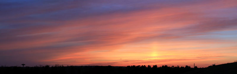 Scenic view of silhouette landscape against sky during sunset