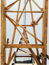 Close-up of metal structure against sky