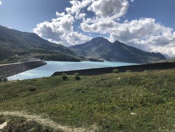 Scenic view of lake and mountains against sky