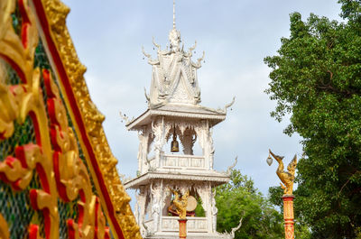 Low angle view of statue against building