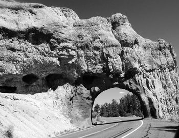 Empty road amidst rock formation