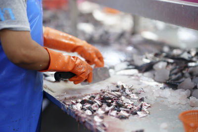 Midsection of man preparing food