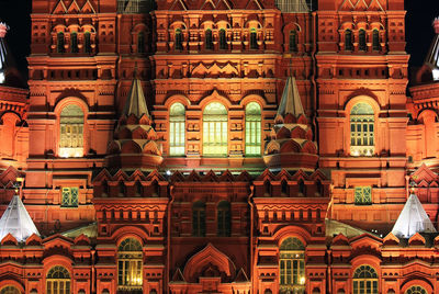 Illuminated red square at night