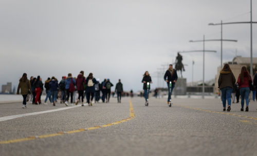 People on road against sky