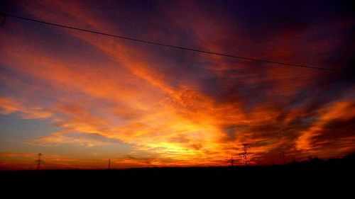 Silhouette of landscape against dramatic sky