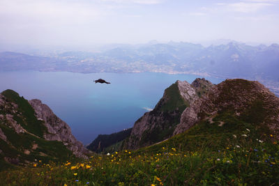 Scenic view of lake and mountains against sky