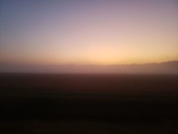 Scenic view of silhouette landscape against sky during sunset