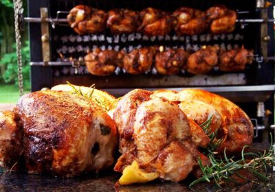 Close-up of roasted meat against barbecue