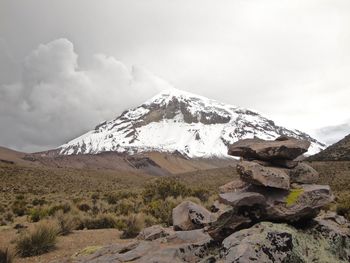 Scenic view of nevado sajama against cloudy sky