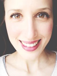 Close-up portrait of a smiling young woman