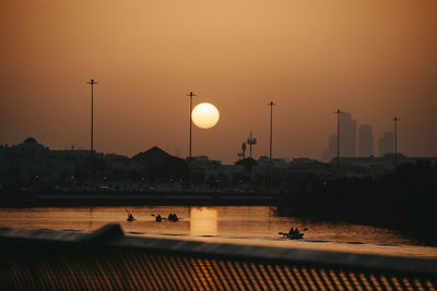 Scenic view of river against sky during sunset