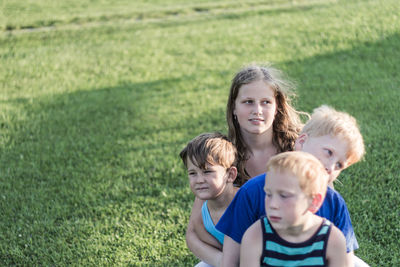 Portrait of children on grass