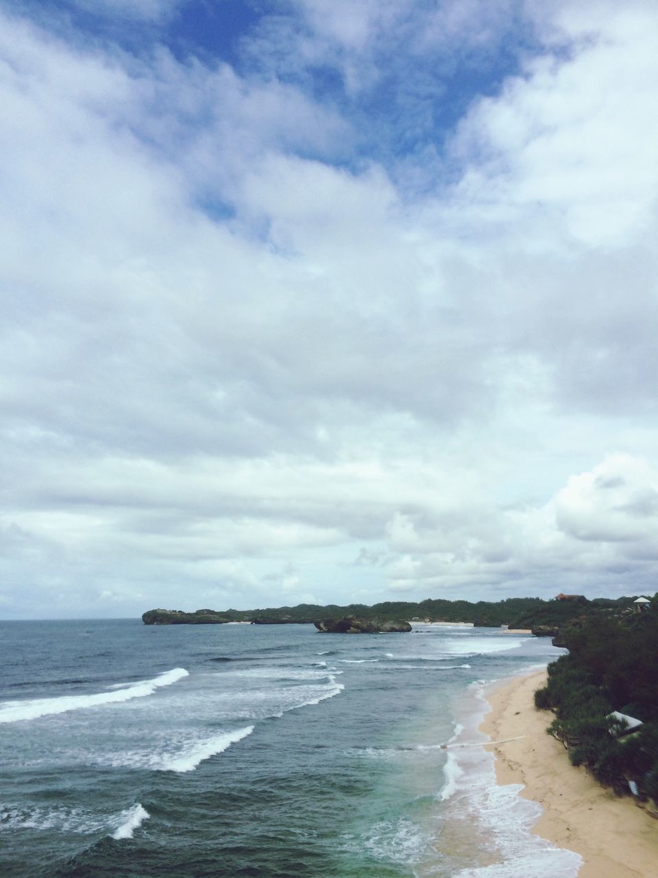 sea, water, beach, horizon over water, sky, shore, scenics, tranquil scene, beauty in nature, tranquility, wave, sand, cloud - sky, surf, nature, cloudy, idyllic, coastline, cloud, day