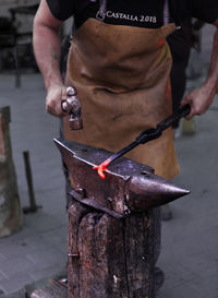 Man working on barbecue grill