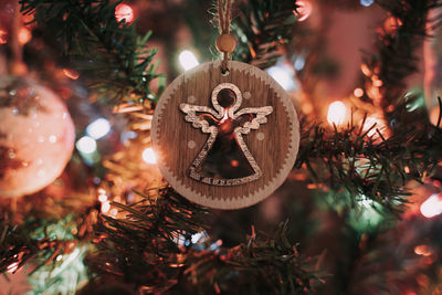 Close-up of illuminated christmas tree and chritsmas ornament 