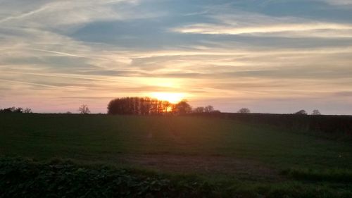 Scenic view of landscape at sunset