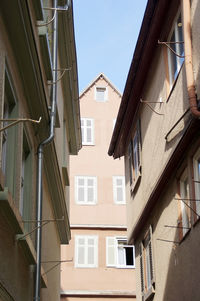 Low angle view of houses against clear sky