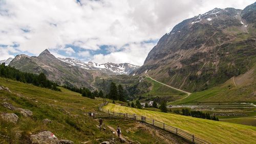 Scenic view of mountains against cloudy sky