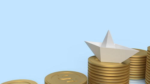 Low angle view of stack against blue background