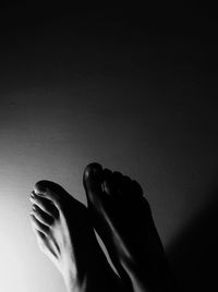 Cropped image of woman standing on tiled floor