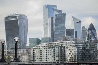Modern buildings in city against sky