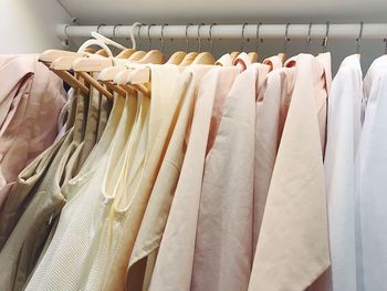 Clothes hanging on rack at store