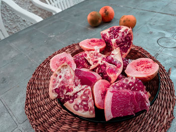 High angle view of strawberries in basket on table