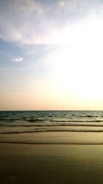 Scenic view of beach against sky during sunset