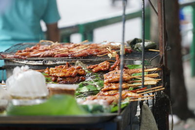 Close-up of meat cooking on barbecue grill