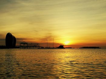 Scenic view of sea against orange sky