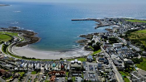 High angle view of buildings by sea